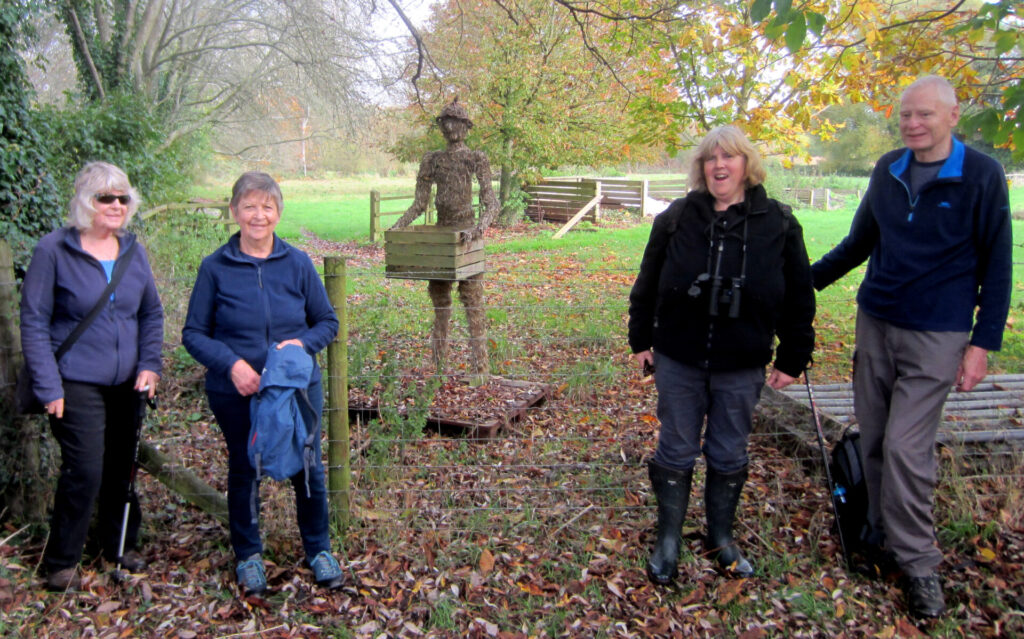 With a fellow "walker", actually a straw statue