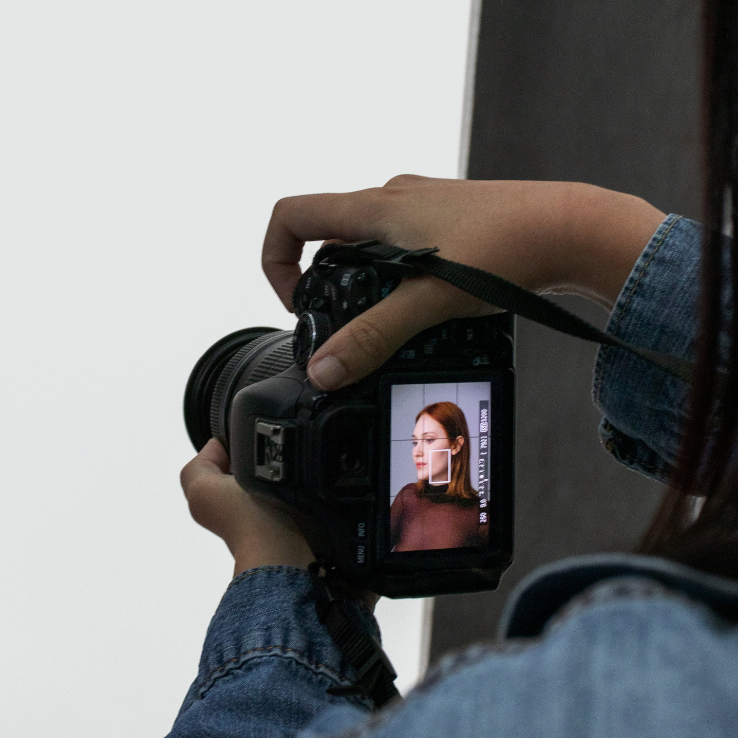 Adjusting the camera to take a portrait